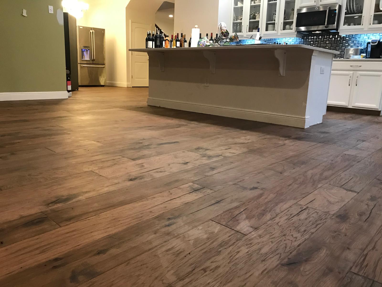 Completed hardwood flooring in an Orlando kitchen and open-plan living area